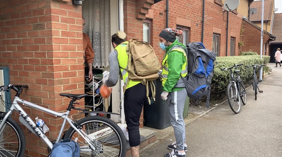 Kurdish Alevy, man and woman, cyclists providing support to the community hit by the Covid pandemic.