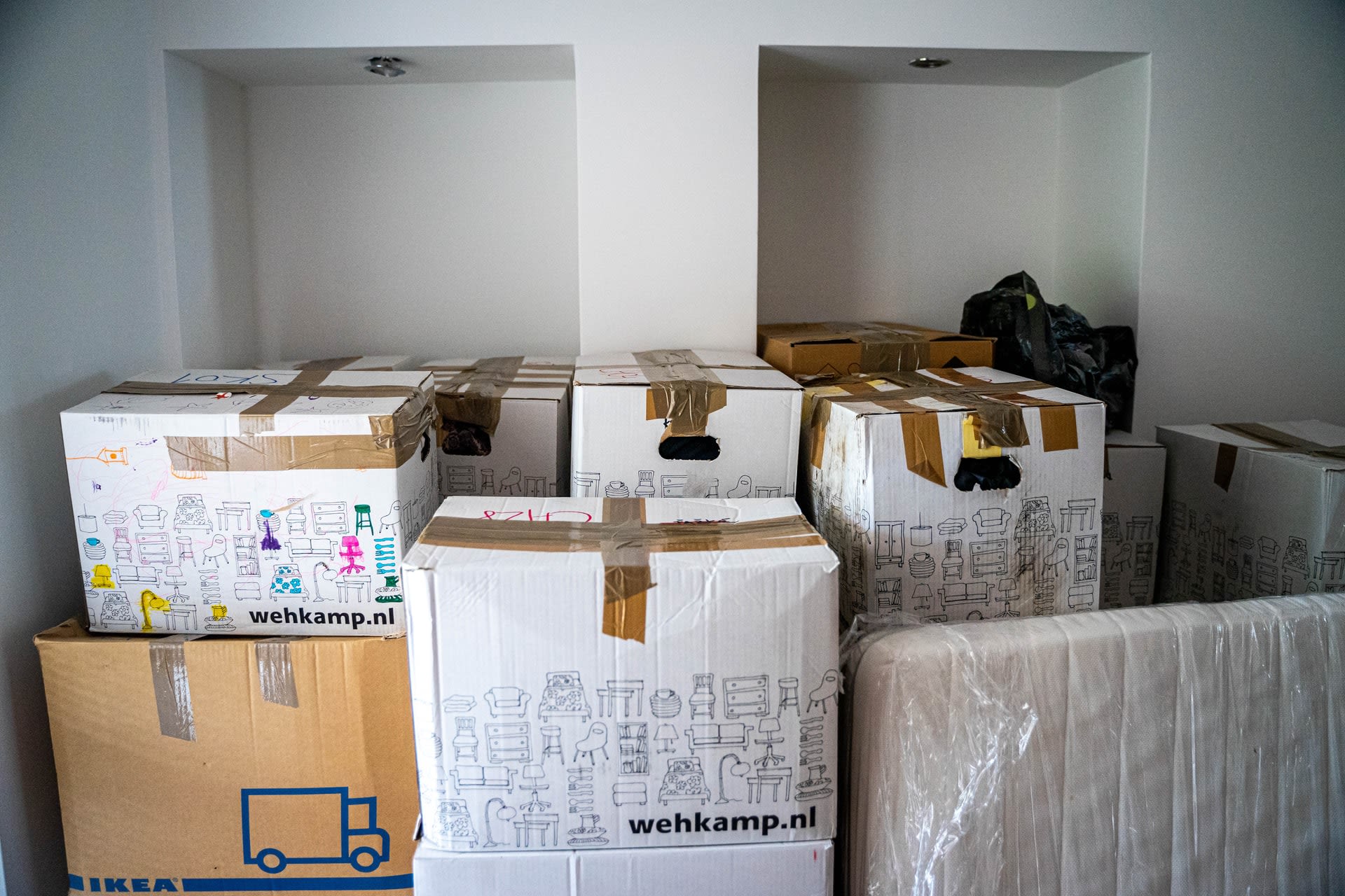 Decorative photo showing cardboard boxes of a home removal